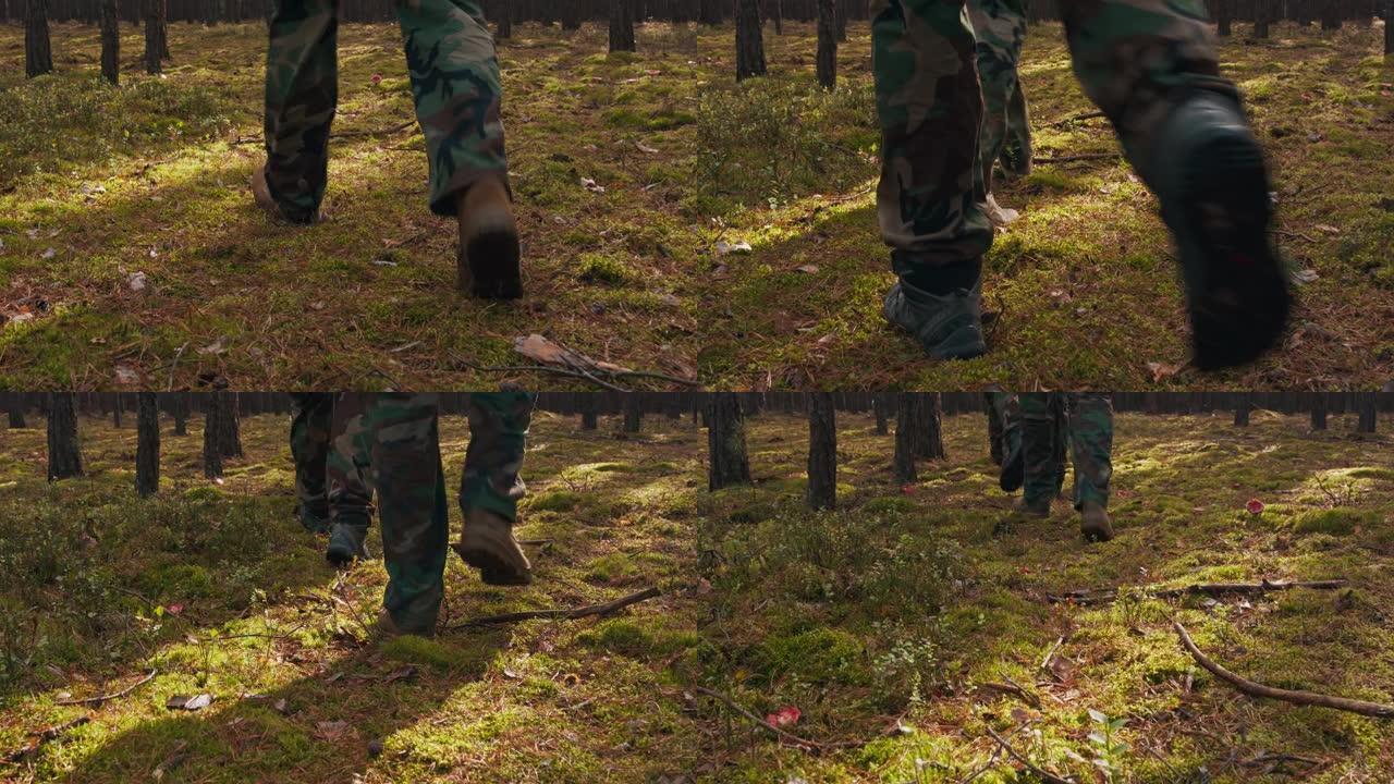 一只军鞋在秋天的灌木丛中行走的特写。小队在中午以队形穿过密林