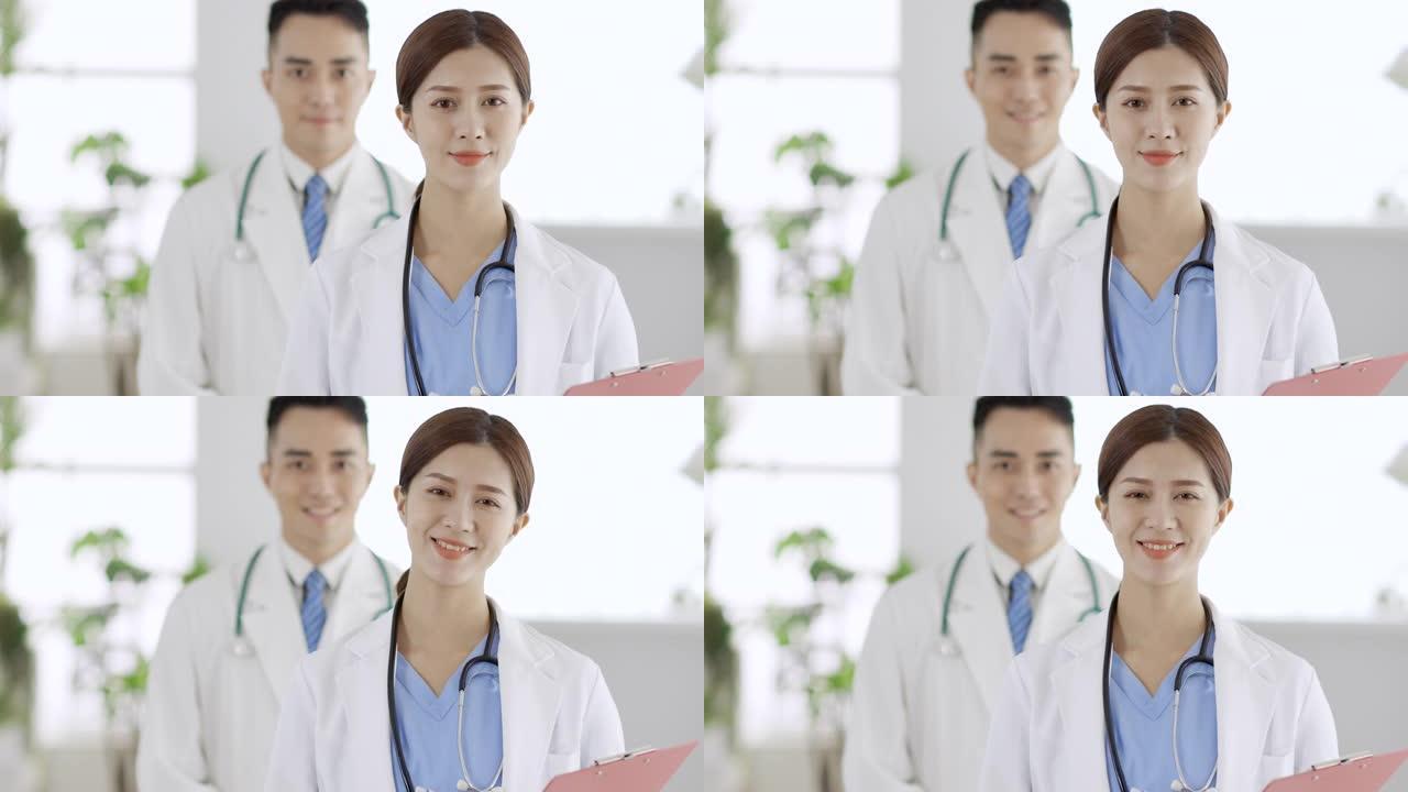 两名医生微笑着站在医院
