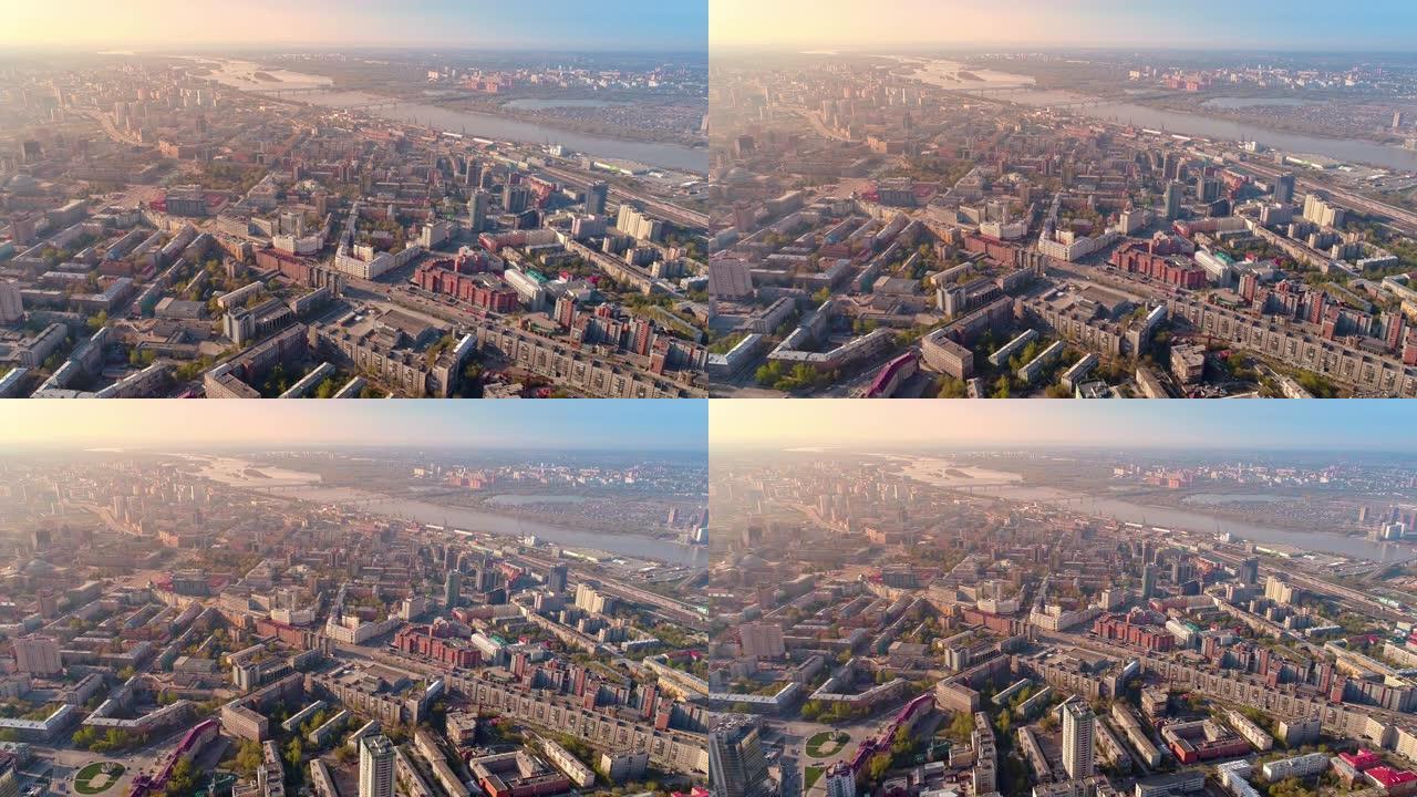 欧洲城市中心的俯视图。河边大城市美丽的日出。阳光眩光。城市生活