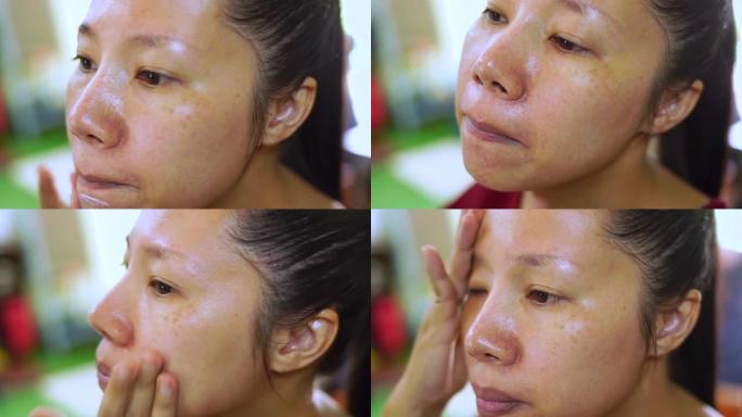 美容常规。美丽的亚洲女人在柔软的水合保湿皮肤上涂抹保湿提拉滋养日霜