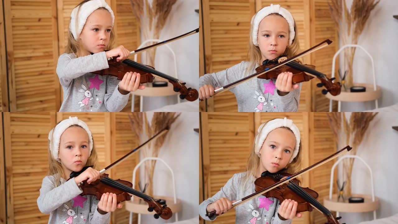 集中的小女孩在家拉小提琴