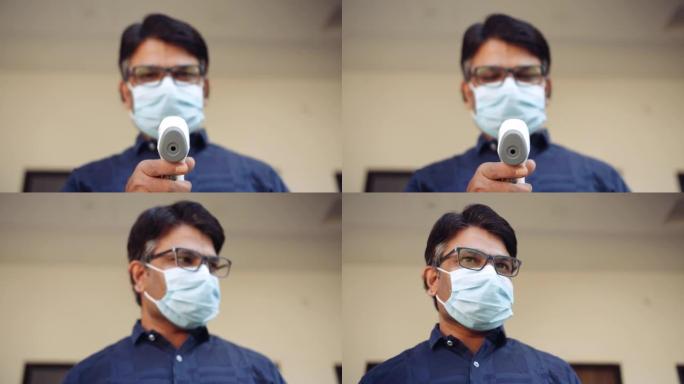 印度男医生在医院走廊走廊上戴着口罩