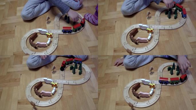 孩子们在客厅玩木制火车