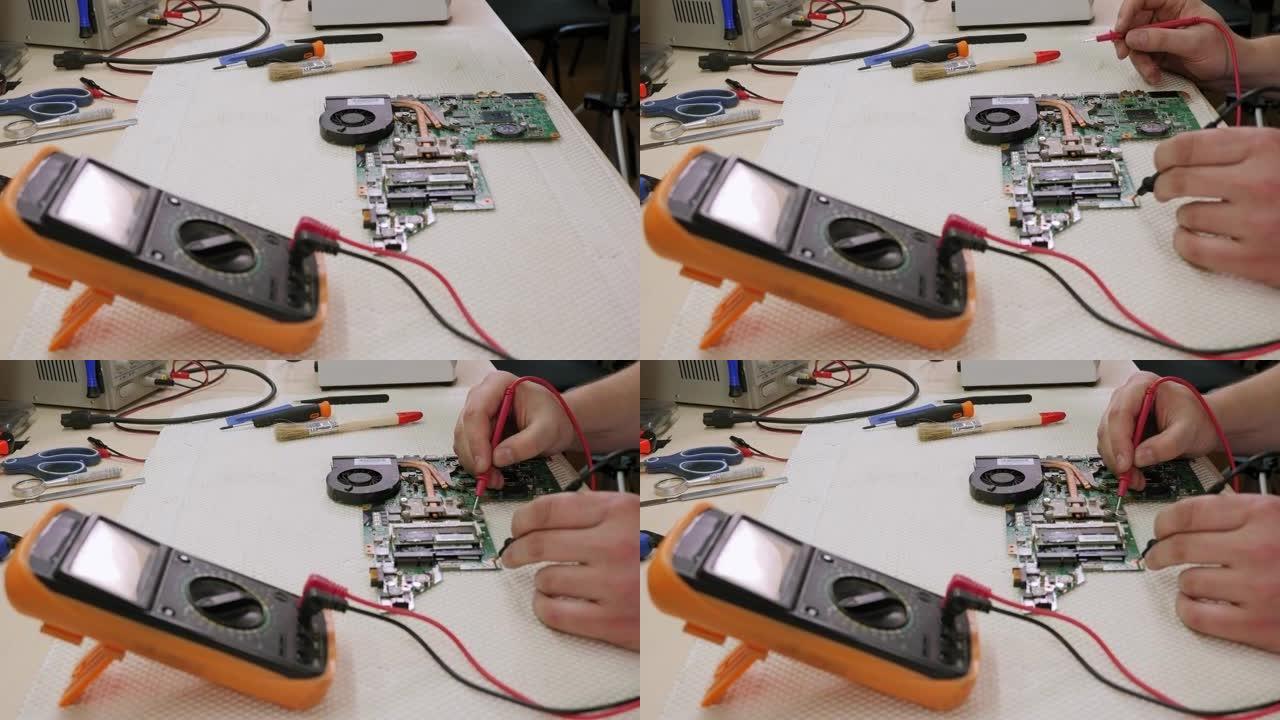 技术员测量计算机主板电压的特写。