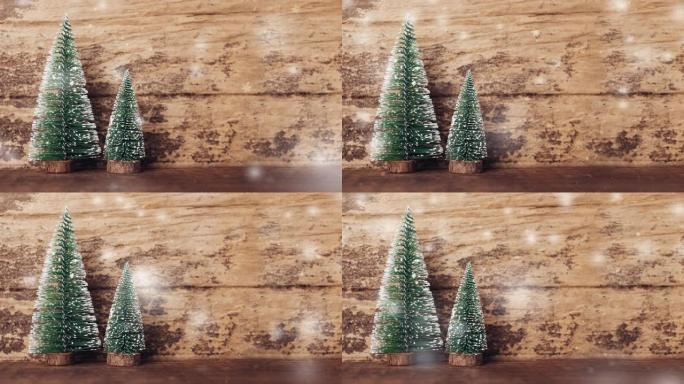 圣诞树，雪落在垃圾木桌和深棕色木墙上。冬季假日贺卡