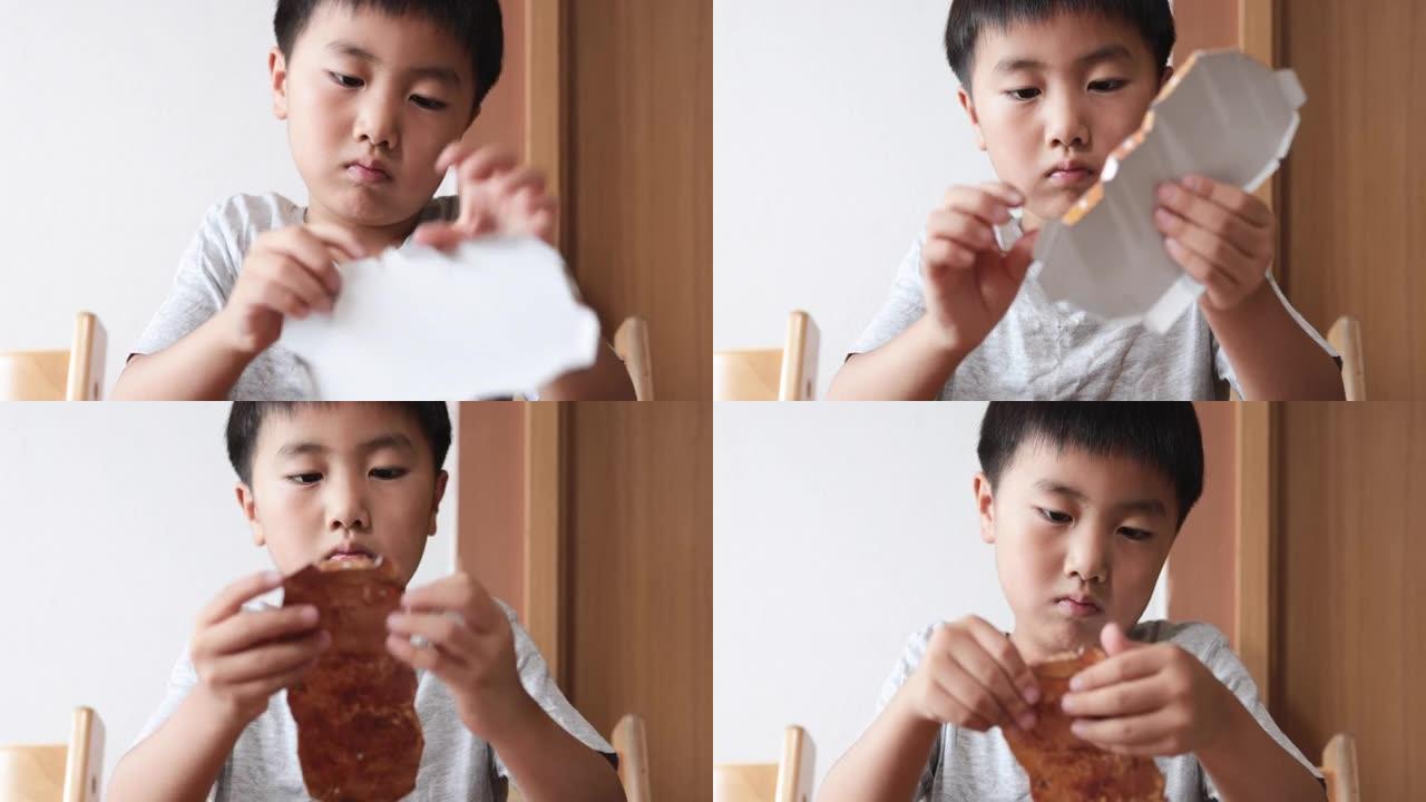 亚洲男孩在家制作纸工艺