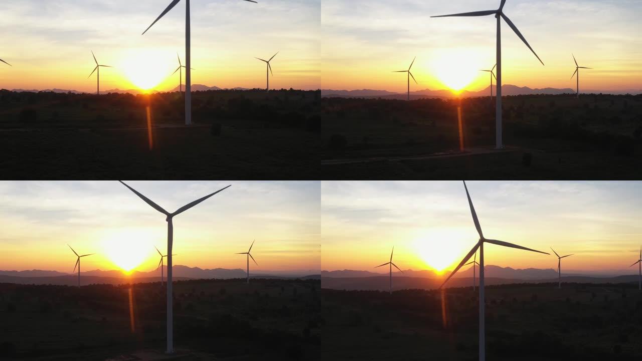 日落时风力发电机4k鸟瞰图，风车，能源生产-绿色技术。可再生能源解决方案