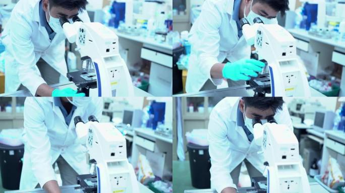 科学家使用显微镜和观察样本