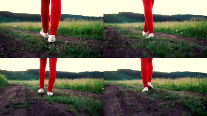 女性脚在田野的土路上行走，慢动作