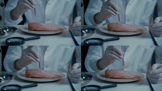 男性营养专家在实验室检测食品。实验室助理测试转基因鸡。放入化学样品和注射来测试鸡肉。转基因食品，注射