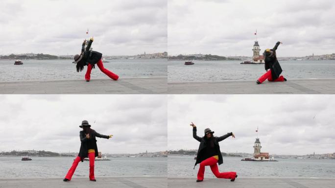 在伊斯坦布尔市的少女塔景前跳舞