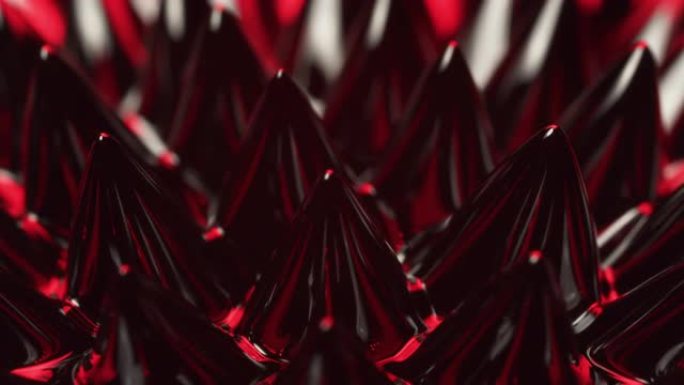 钕磁铁移动的铁磁流体物质上的磁性和红光产生视觉效果。VJ，科幻小说和抽象艺术背景。红色相机。