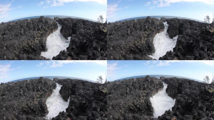 岩石缝隙中泡沫波的手持镜头。