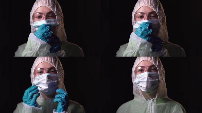 穿着白色防护服的年轻女医生的肖像照。在脸上戴上医用口罩。打击新型冠状病毒肺炎的概念
