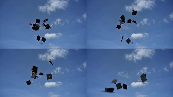 毕业生向天空扔上一顶黑帽子，以表达他们在大学毕业时的喜悦。