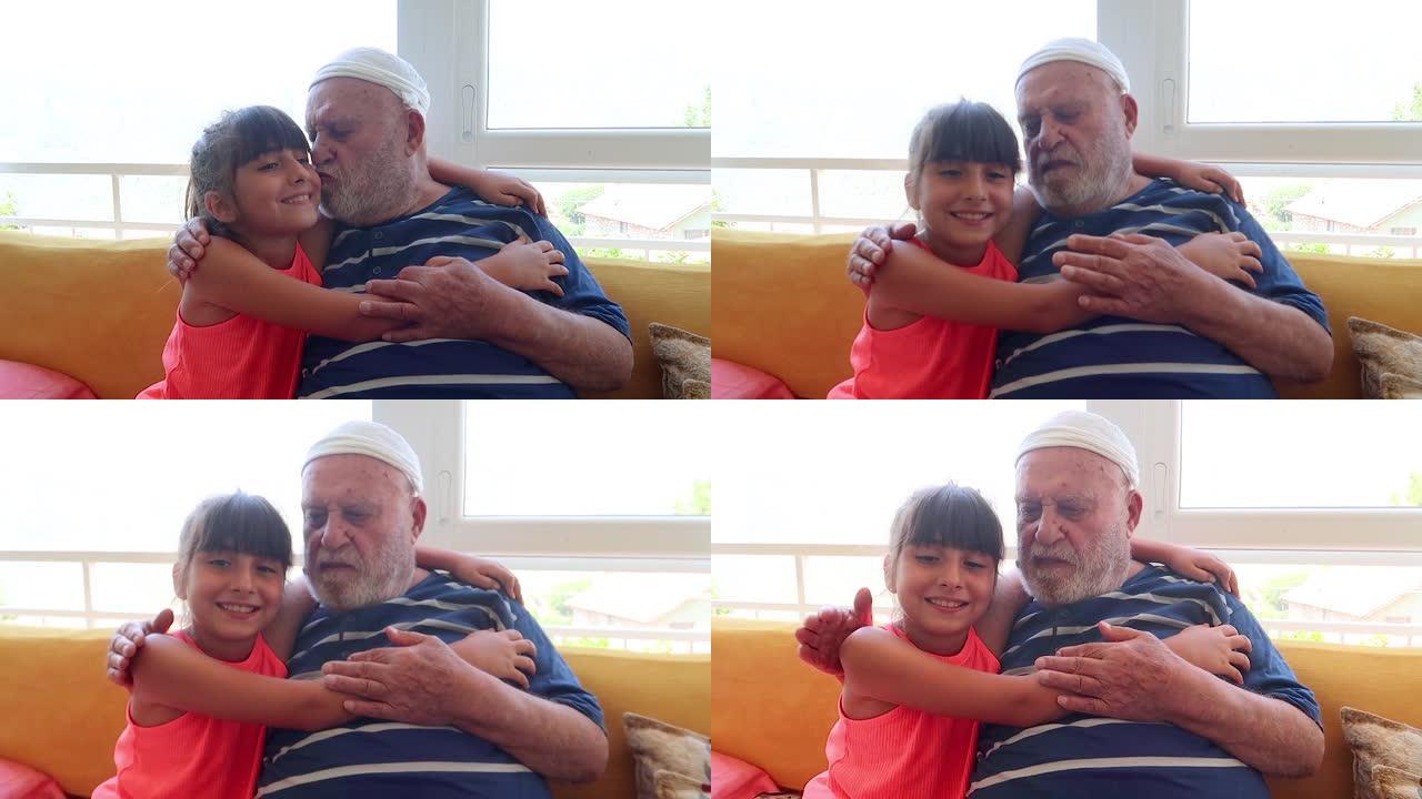 一个可爱的土耳其女孩，祖父在家里拥抱