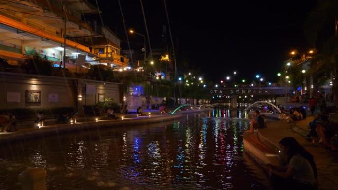 巴厘岛夜间时间著名的登巴萨市河畔浪漫海滨长廊湾全景4k印度尼西亚