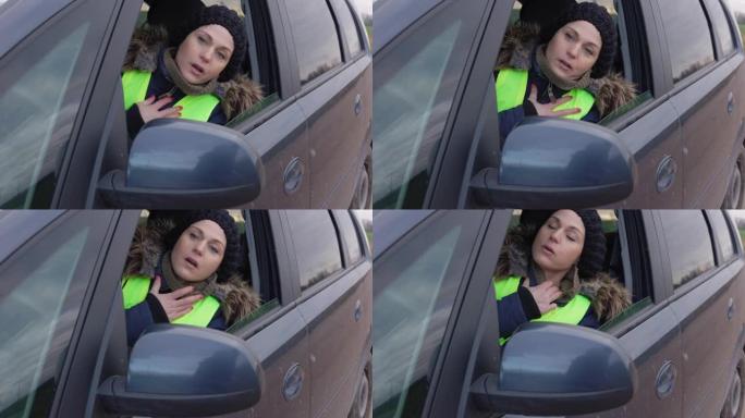 悲伤的女人在汽车上与呼吸急促作斗争