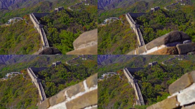 慢动作定格镜头拍摄的中国长城，在山的一侧上升在一个开始的下降。镜头从长城的楼梯上走下来