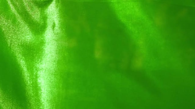 绿色丝布在特写和慢动作中随风飘动