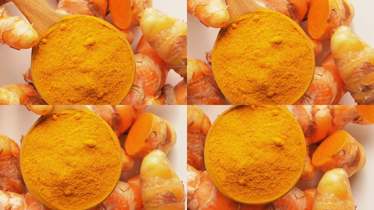 木勺旋转中的姜黄和姜黄粉