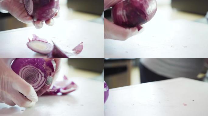 在白色砧板上切紫色洋葱。