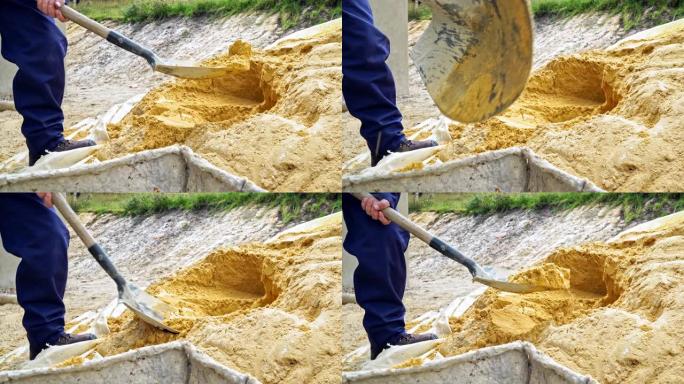 拉丁裔建筑工人在铲子的帮助下收集沙子