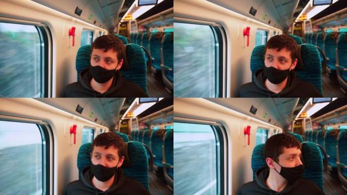 一名戴着口罩的男子在公共交通火车上移动