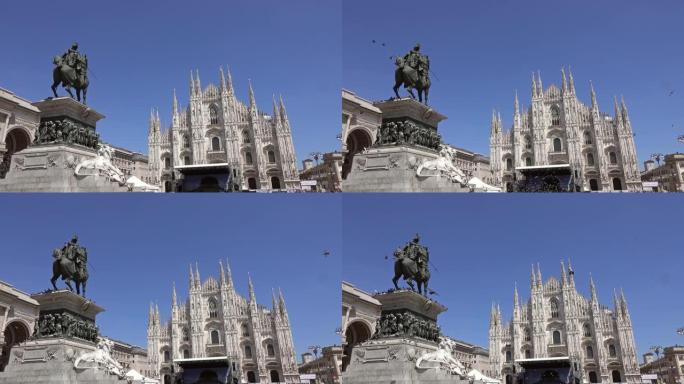 许多鸽子飞越米兰的大教堂广场