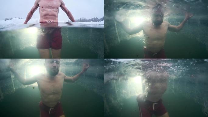 冬天游泳。年轻人在冬天的湖里游泳。分割镜头和水下冰冷的海水