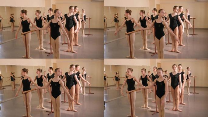 一群年轻优雅的女孩在芭蕾舞团附近的芭蕾舞学校里。