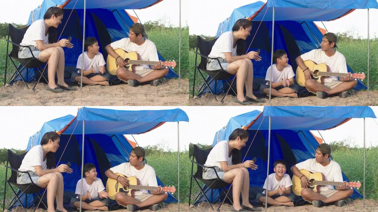 快乐的亚洲家庭父母孩子去度假露营