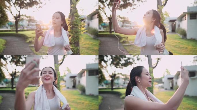 年轻活跃的亚洲女性视频在公园锻炼时与朋友通话，背景是日落，分享健康的生活方式故事，人类现代技术，适应
