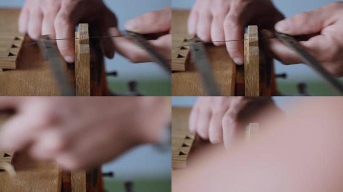 细木工用手锯在橡木木板上切出燕尾榫。手工木工。木工工具的声音