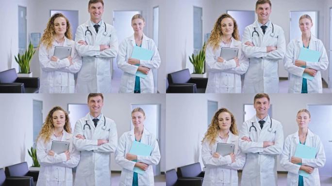 医院走廊中间镜头前微笑的大医生肖像女士医生拿着数码平板电脑和地图