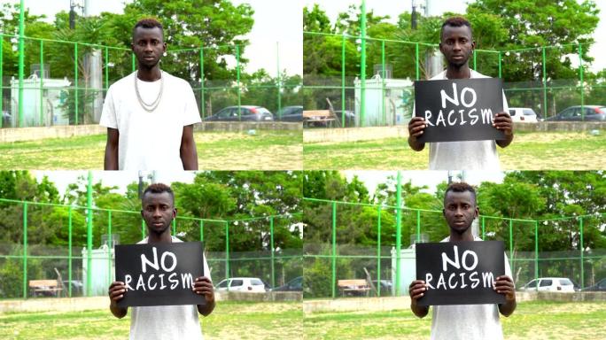 非洲青年抗议者手持纸板“禁止种族歧视”