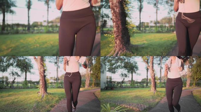 年轻女子在阳光明媚的日子在公园里跑步，放松慢跑，人体免疫系统，饮食适合坚定的身体，covid19大流