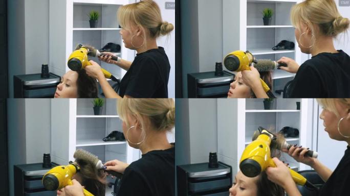 美容师在客厅给新发型后吹干女人的头发