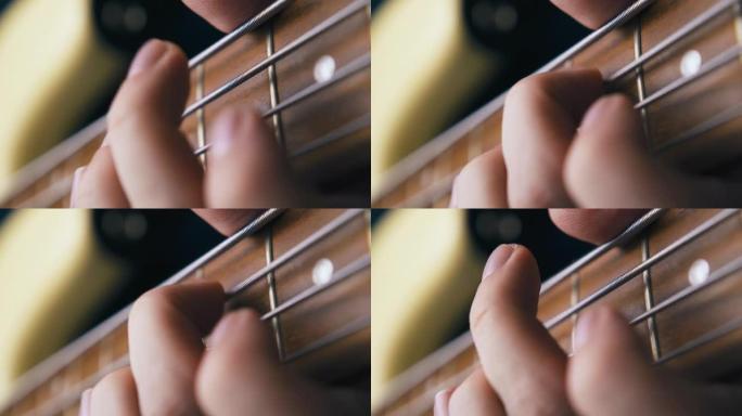艺术家手指用音高转换技术演奏低音吉他