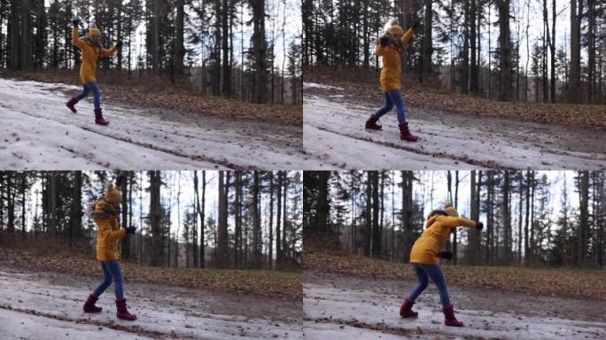 十几岁的女孩在冬天的森林里在雪地上滑行