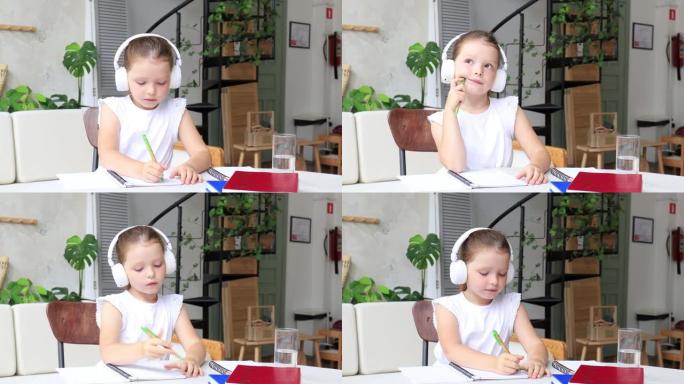 六岁漂亮脸蛋的小女孩戴着耳机，拿着智能手机远程学习在线课程，老师写笔记。