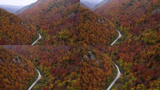 秋季天线。秋天，空中公路穿越蜿蜒的山路，汽车驶过五颜六色的森林。