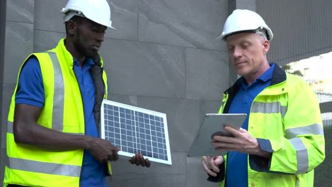 工程师和技术人员讨论检查太阳能电池更换电源