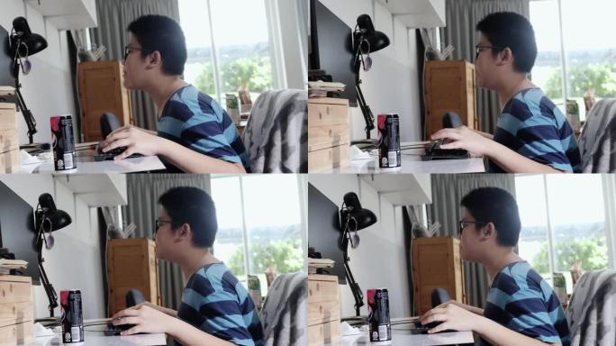 快乐的亚洲游戏玩家男孩戴着防护眼镜，在家玩网络游戏，生活理念。