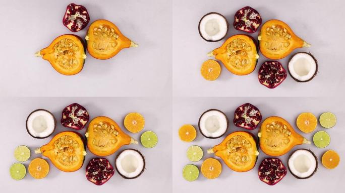 切成薄片的南瓜，椰子，石榴，酸橙和橙子以银色为主题。停止运动