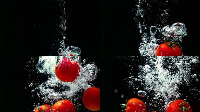 西红柿落入水中黑色背景超慢动作1000 fps
