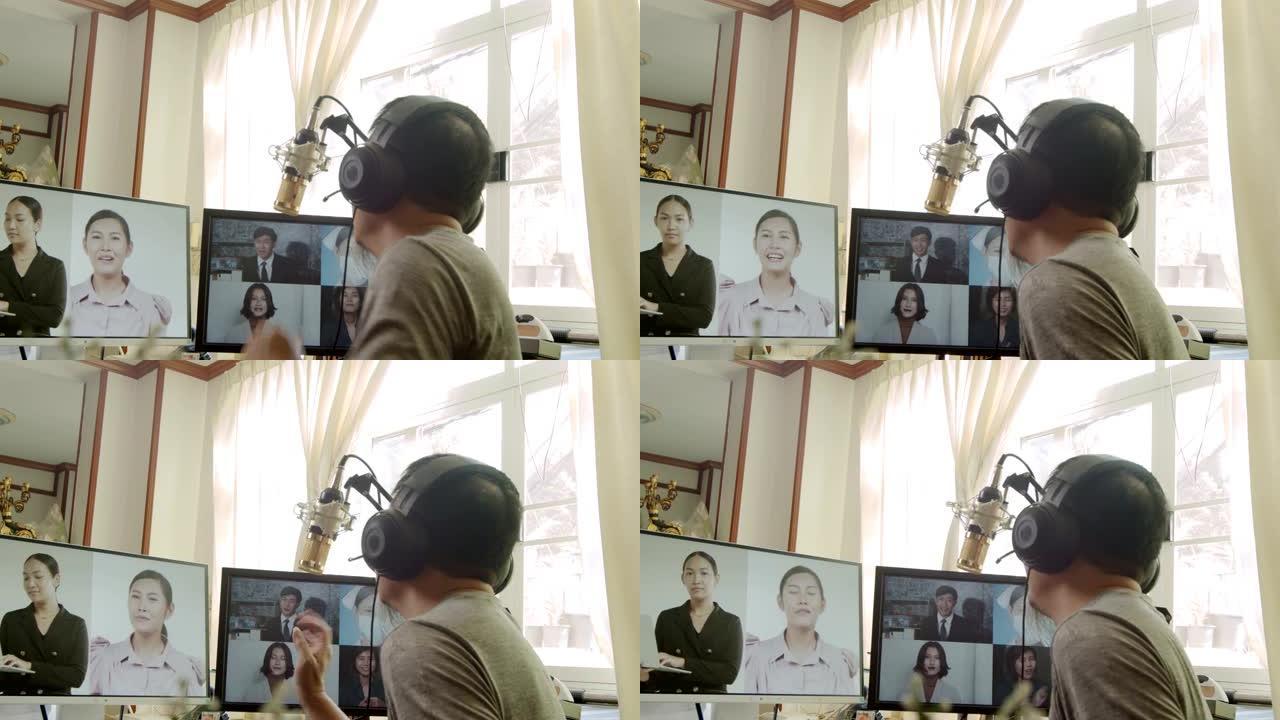 男人在家工作，参加视频会议中的虚拟会议人员