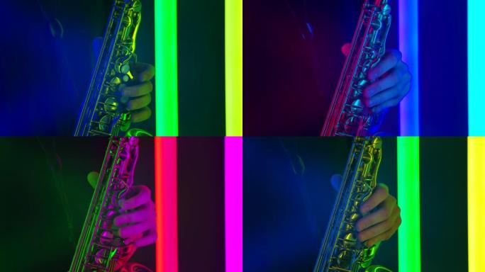 金色闪亮的萨克斯风特写。在黑暗的工作室中，明亮的霓虹灯的背景下，男性手触摸管乐器的琴键的详细镜头。慢