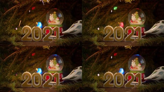 新年的数字2021在圣诞树的背景上。