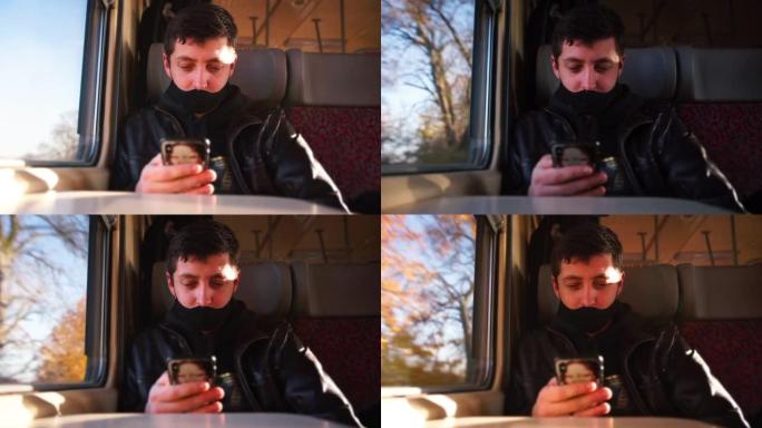 男子使用手机火车马车手持智能手机使用移动互联网